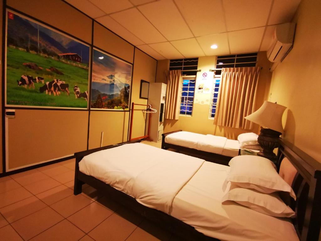 Двухместный (Стандартный двухместный номер с 2 отдельными кроватями) хостела Masada Bed & Breakfast, Кота-Кинабалу