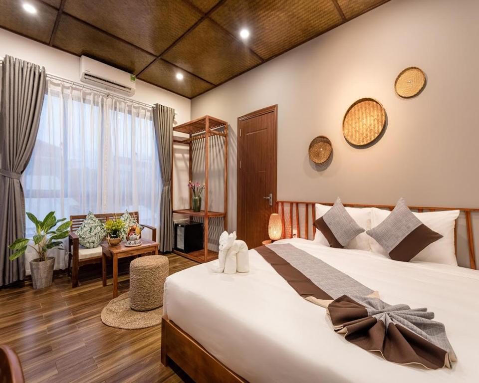 Двухместный (Улучшенный двухместный номер с 1 кроватью) виллы Tropical Home Villa, Хойан