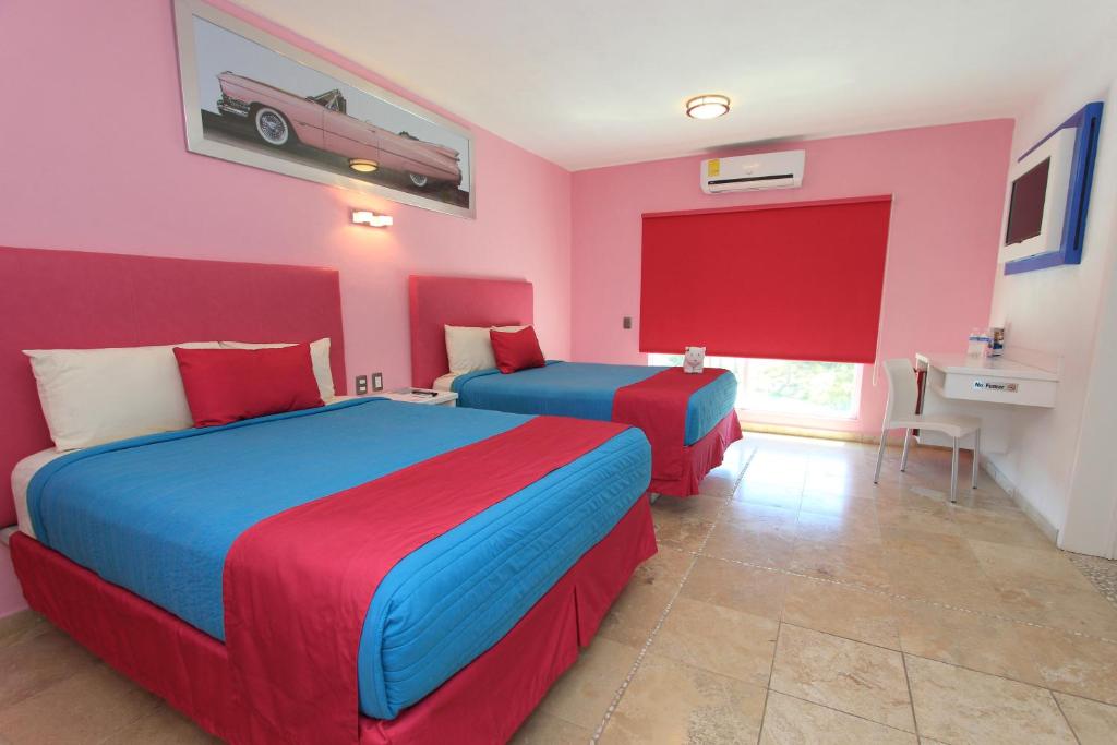 Двухместный (Двухместный номер Делюкс с 2 двуспальными кроватями) отеля Miami Inn, Нуэво-Вальярта
