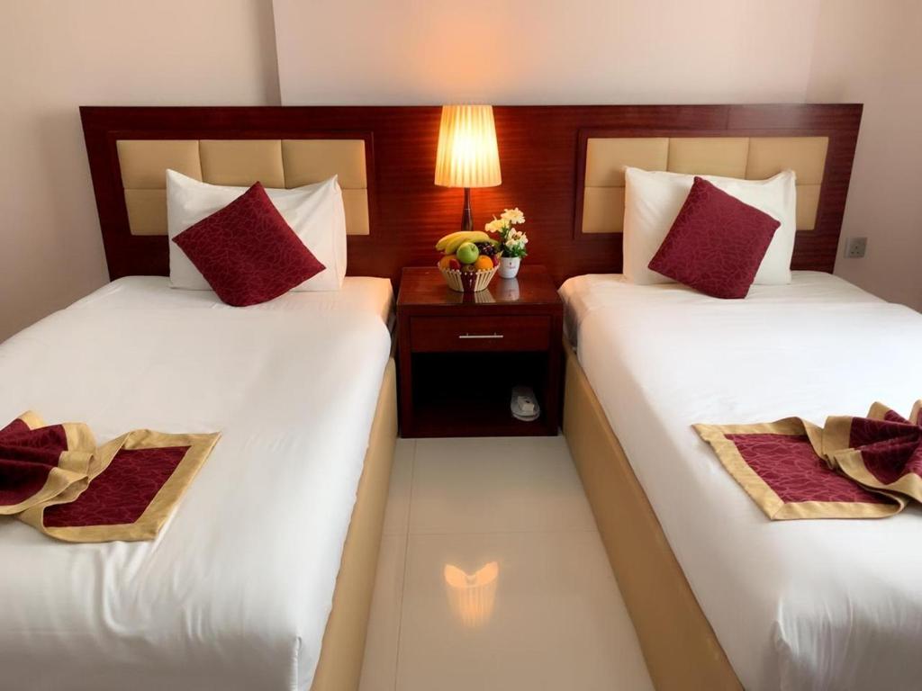 Двухместный (Представительский двухместный номер с 2 отдельными кроватями) апарт-отеля Hala Inn Hotel Apartments, Аджман