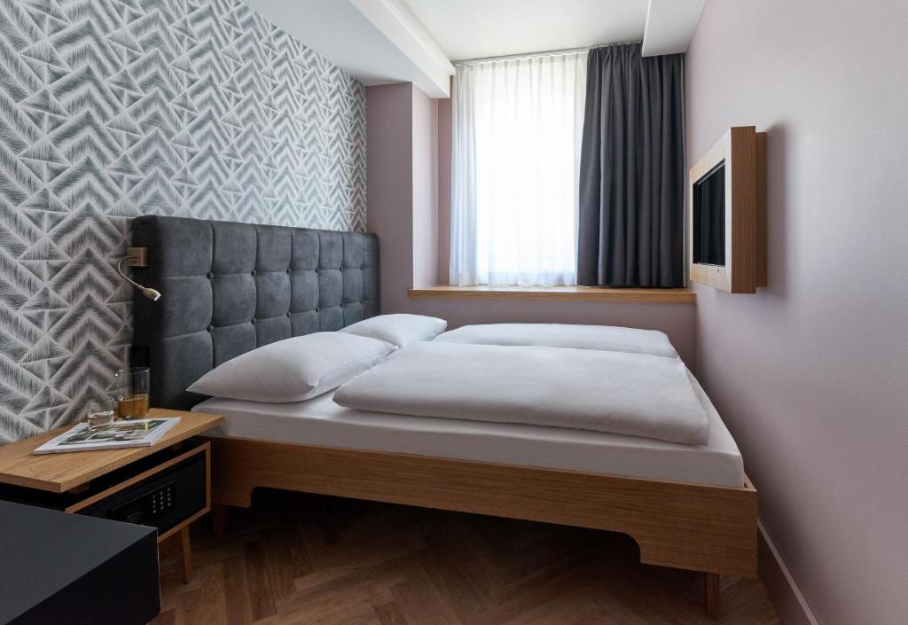 Двухместный (Небольшой двухместный номер с 1 кроватью) отеля Hotel MIO by AMANO, Мюнхен