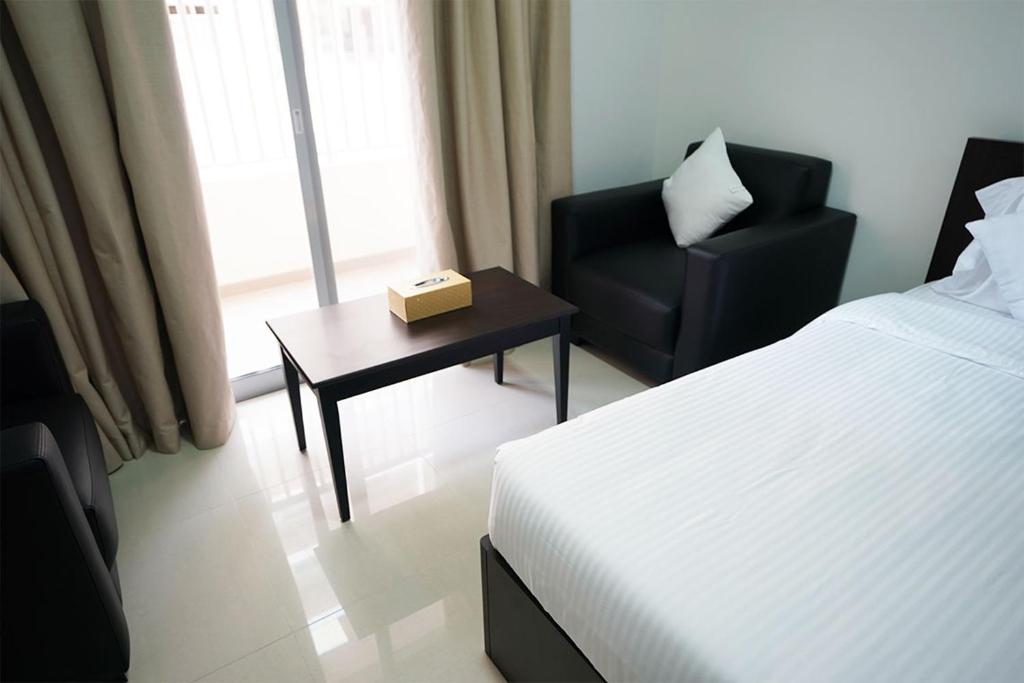 Двухместный (Стандартный двухместный номер с 2 отдельными кроватями) отеля Aurak Guest House, Рас-эль-Хайма