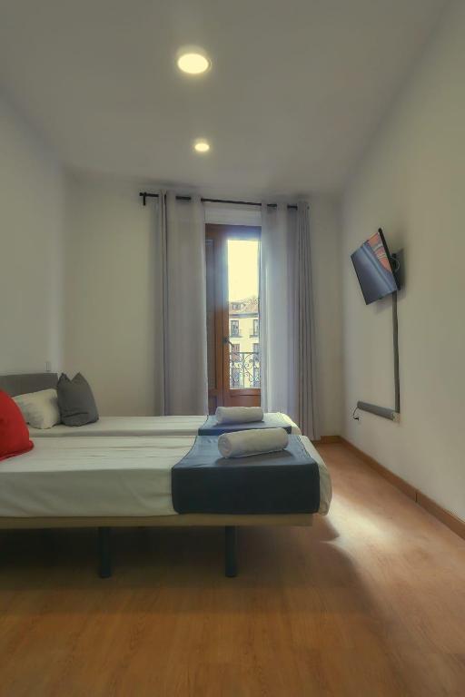 Двухместный (Стандартный двухместный номер с 2 отдельными кроватями и общей ванной комнатой) гостевого дома GS Latina, Мадрид