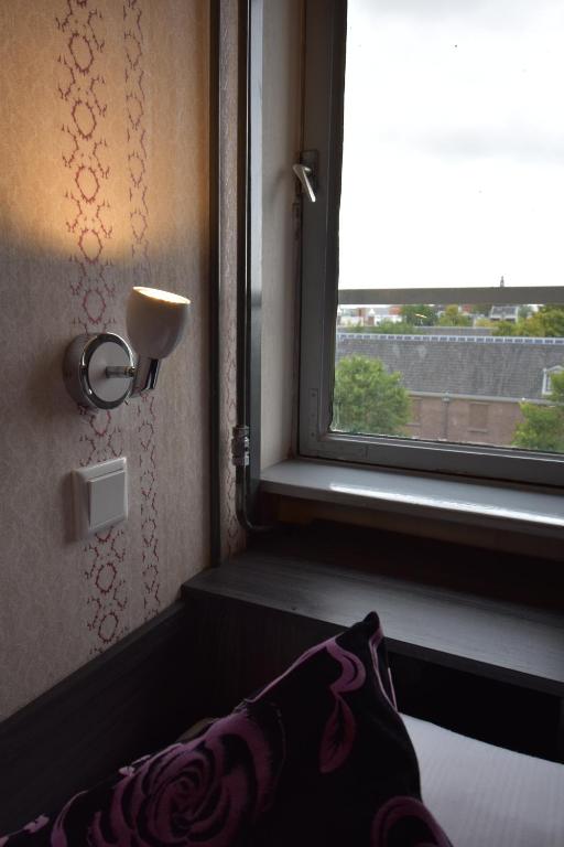 Двухместный (Небольшой двухместный номер с 2 отдельными кроватями) отеля Hotel Hermitage Amsterdam, Амстердам