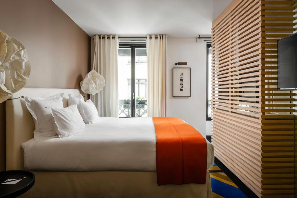 Двухместный (Двухместный номер Делюкс с 1 кроватью или 2 отдельными кроватями) отеля Hôtel du Ministère, Париж