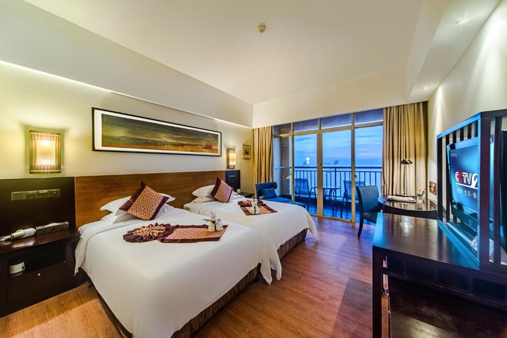 Двухместный (Улучшенный двухместный номер с 2 отдельными кроватями и видом на море) отеля Shengyi Holiday Villa Hotel, Санья