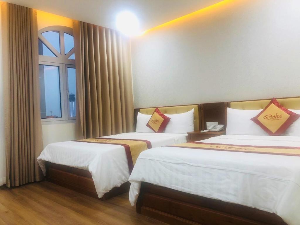Четырехместный (Улучшенный номер с 2 кроватями размера «queen-size») отеля Doha 2 Hotel Saigon Airport, Хошимин