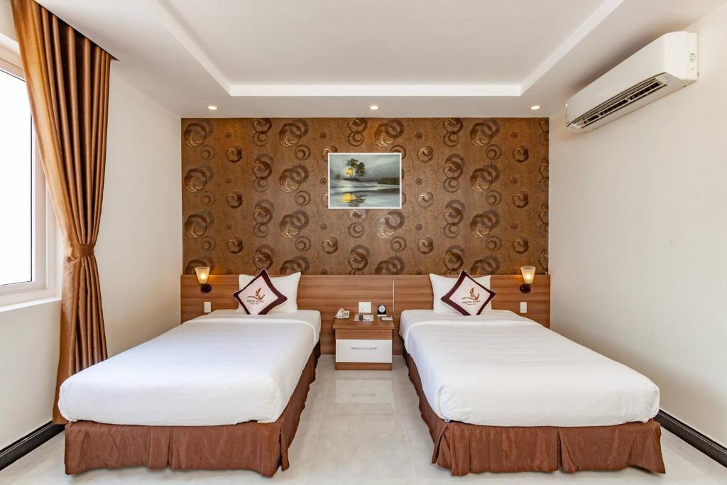 Двухместный (Двухместный номер Делюкс с 2 отдельными кроватями) отеля Phung Hung Boutique Hotel, Дуонг-Донг