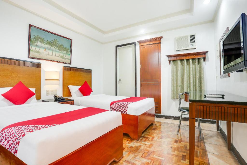 Двухместный (Двухместный номер Делюкс с 2 отдельными кроватями) отеля OYO 406 Royal Parc Inn & Suites, Манила