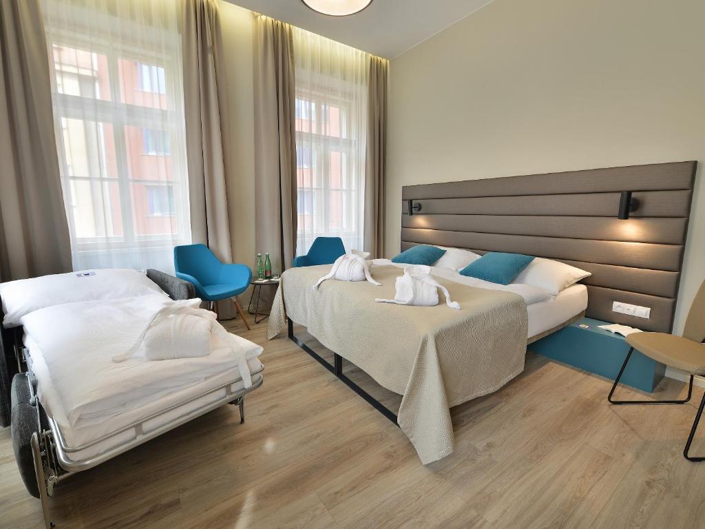 Двухместный (Двухместный номер с 1 кроватью или 2 отдельными кроватями и дополнительной кроватью) отеля EA Hotel New Town, Прага