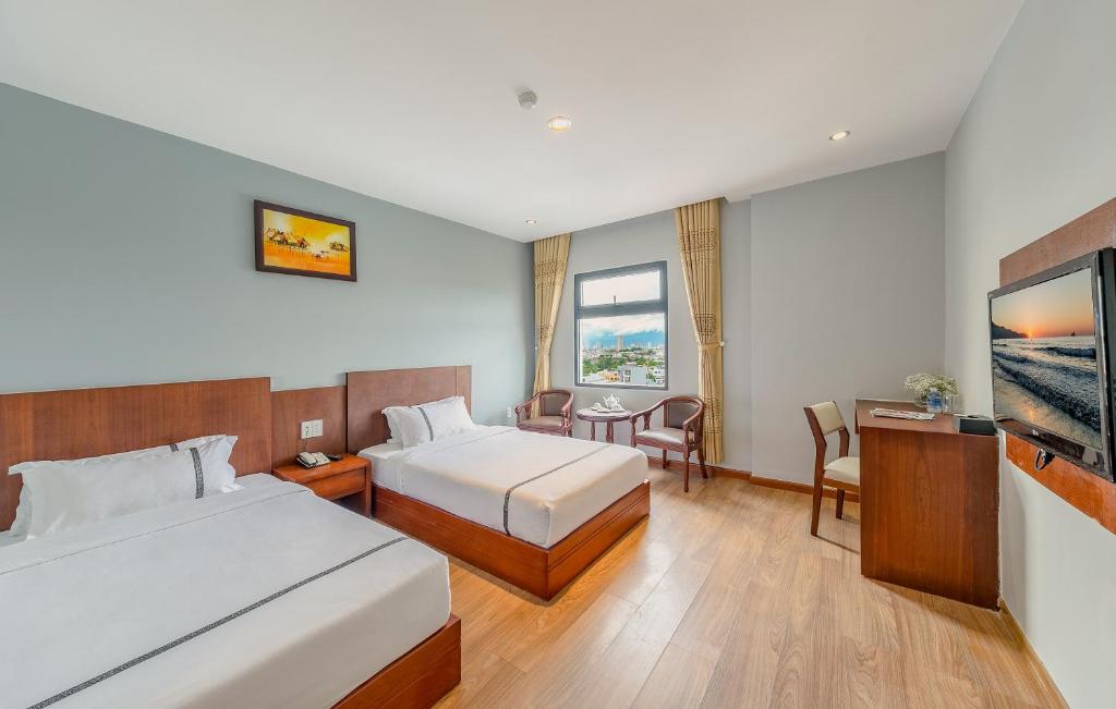 Двухместный (Улучшенный двухместный номер с 2 отдельными кроватями и частичным видом на море) отеля Fansipan Da Nang Hotel, Дананг