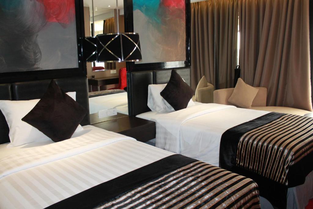 Двухместный (Двухместный номер Делюкс с 2 отдельными кроватями) отеля Amaroossa Cosmo Jakarta, Джакарта