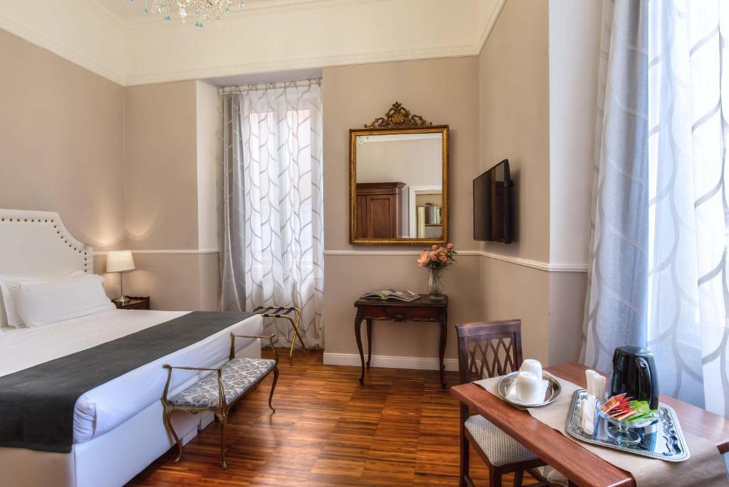 Двухместный (Улучшенный двухместный номер с 1 кроватью или 2 отдельными кроватями) отеля I Tre Moschettieri, Рим