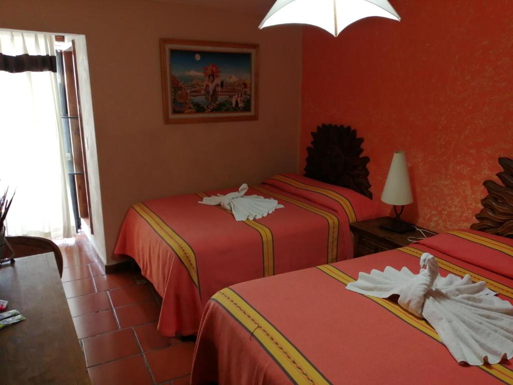 Двухместный (Двухместный номер с 2 двуспальными кроватями) отеля Hotel El Rey, Таско-де-Аларкон