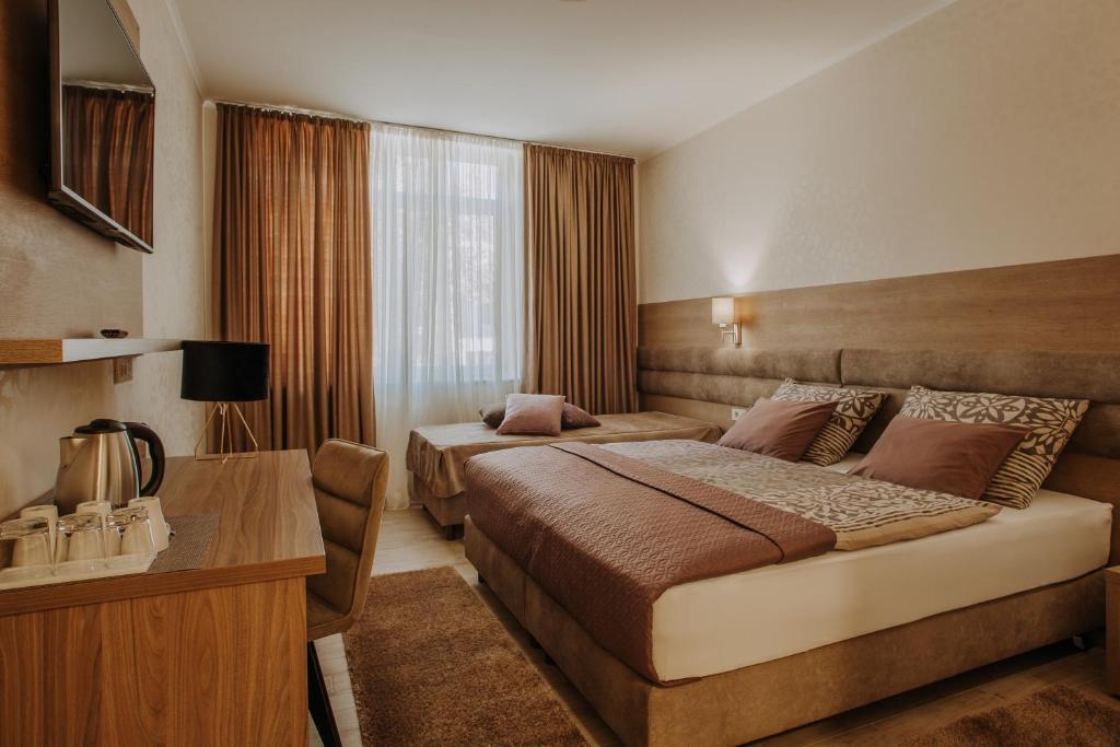 Трехместный (Стандартный трехместный номер) отеля Apartments and Rooms Villa Martini, Винковци