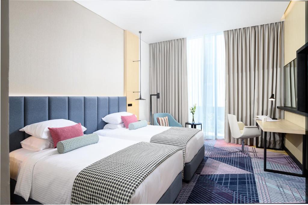Двухместный (Двухместный номер Делюкс с 2 отдельными кроватями) отеля Millennium Al Barsha, Дубай