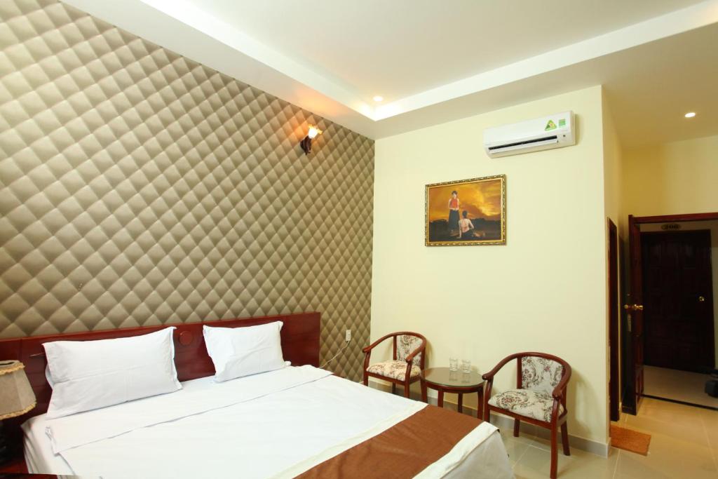 Двухместный (Двухместный номер Делюкс с 1 кроватью и балконом) отеля Nhat Minh Hotel, Лаги