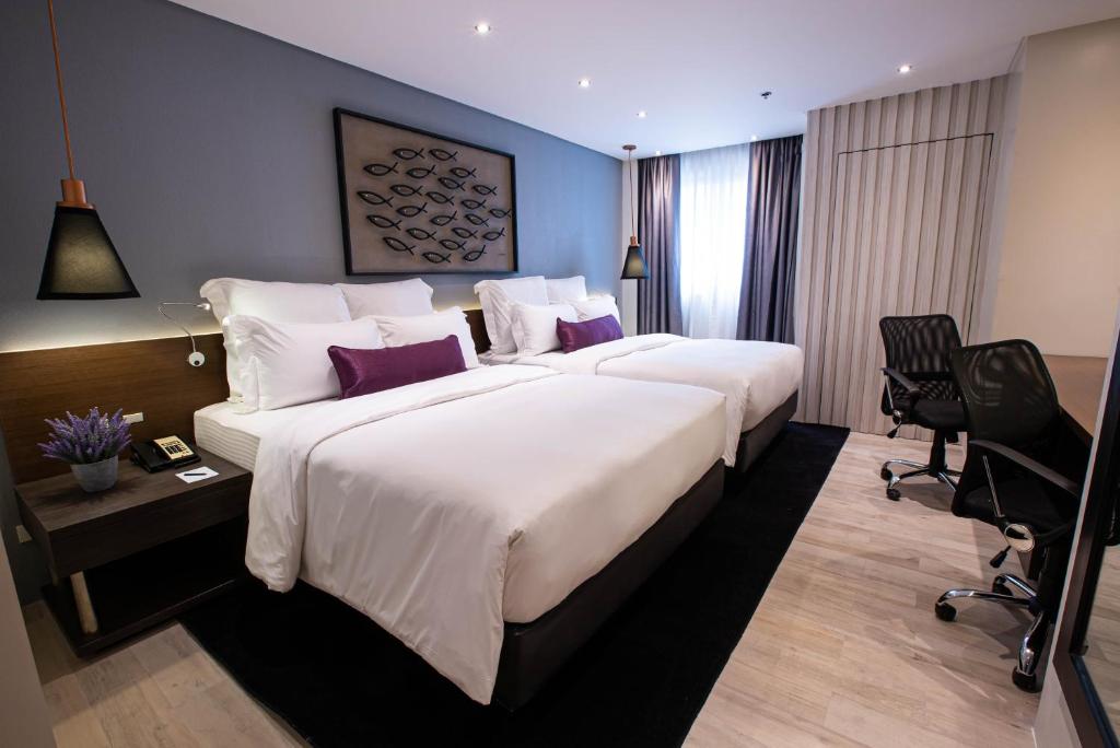 Двухместный (Улучшенный двухместный номер с 2 отдельными кроватями) отеля Coro Hotel, Манила