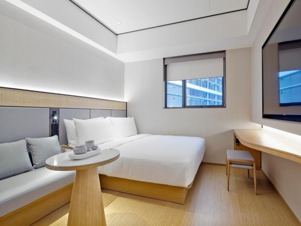 Двухместный (Улучшенный двухместный номер с 1 кроватью) отеля Innotel Hotel, Сингапур (город)