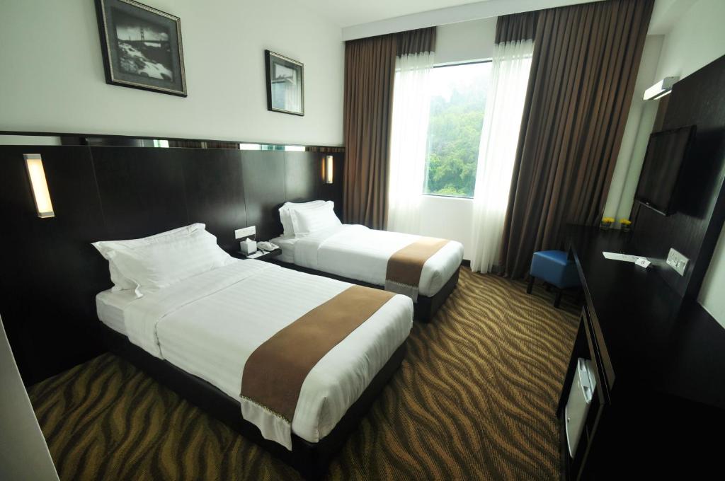 Двухместный (Двухместный номер Делюкс с 2 отдельными кроватями) отеля Dreamtel Kota Kinabalu, Кота-Кинабалу