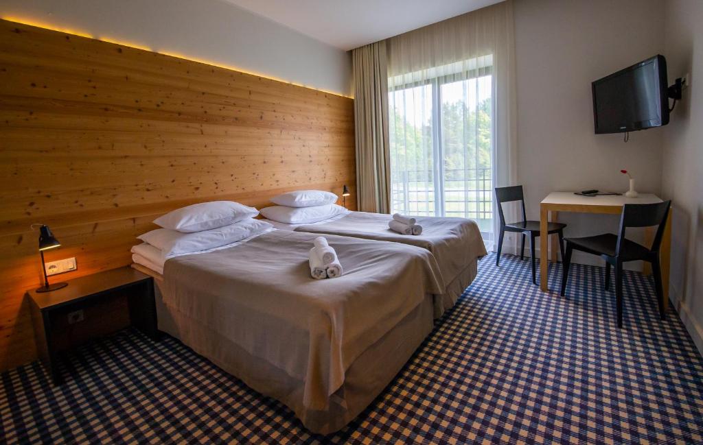 Двухместный (Двухместный номер с 2 отдельными кроватями) отеля Kassari Puhkekeskus, Кайна