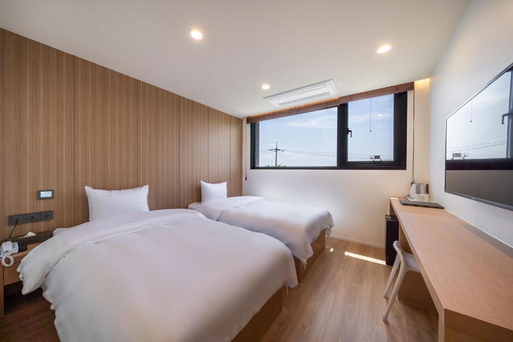 Двухместный (Стандартный двухместный номер с 2 отдельными кроватями) отеля Aroomi Hotel, Согвипхо