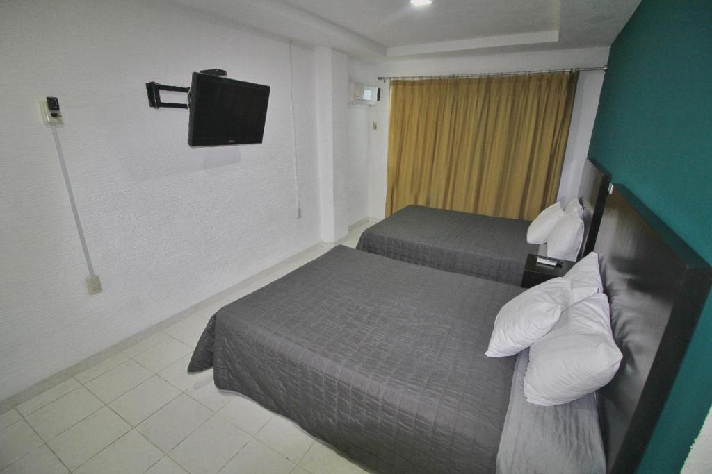 Двухместный (Двухместный номер с 2 двуспальными кроватями) отеля Hotel EMS Real de Boca, Веракрус
