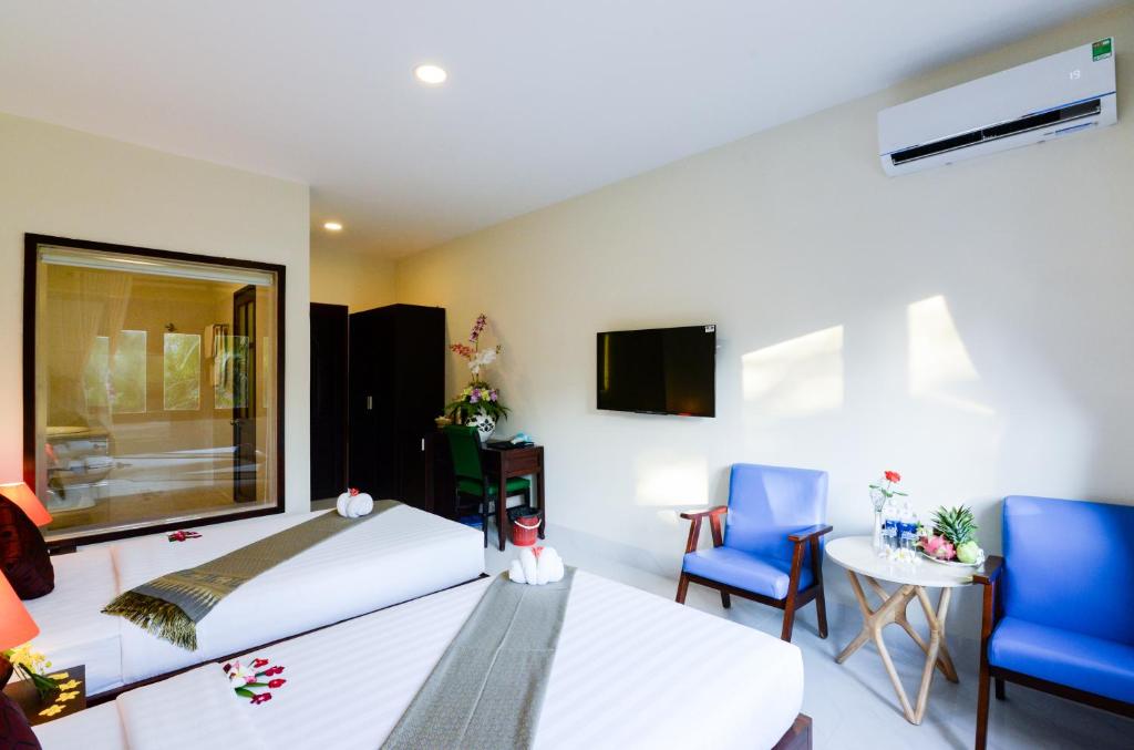 Двухместный (Стандартный двухместный номер с 1 кроватью или 2 отдельными кроватями и видом на сад) курортного отеля Four Oceans Resort, Фантхьет