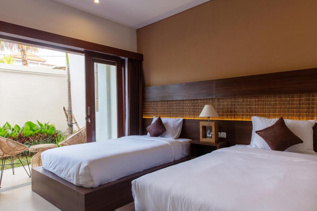 Двухместный (Стандартный двухместный номер с 2 отдельными кроватями и балконом) отеля Ratan Hotel Uluwatu, Улувату