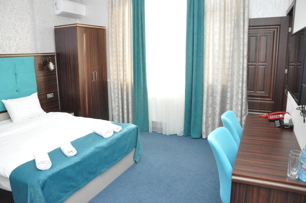 Четырехместный (Четырехместный номер с собственной ванной комнатой) отеля Saf Inn на Каверочкина, Баку