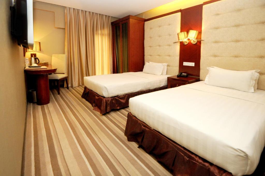 Двухместный (Улучшенный стандартный двухместный номер с 1 кроватью или 2 отдельными кроватями) отеля Celyn City Hotel, Кота-Кинабалу
