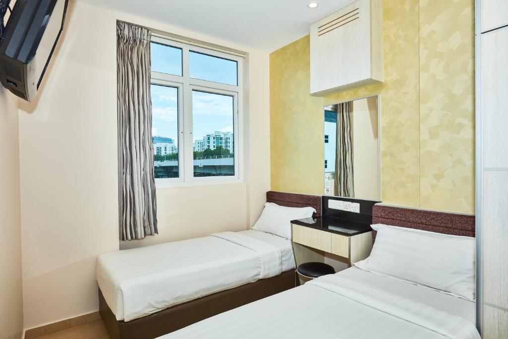 Двухместный (Улучшенный двухместный номер с 2 отдельными кроватями) отеля Fragrance Hotel - Royal, Сингапур (город)