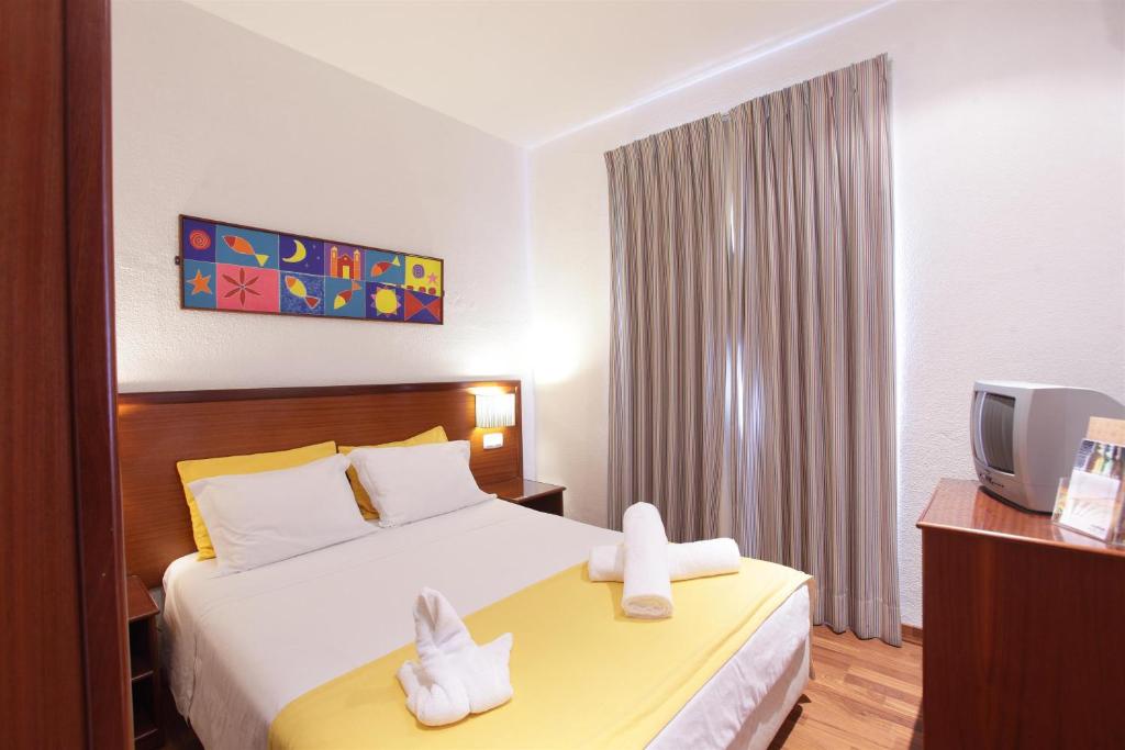 Двухместный (Двухместный номер с 1 кроватью или 2 отдельными кроватями) отеля Residencial Mar e Sol, Кошта-да-Капарика