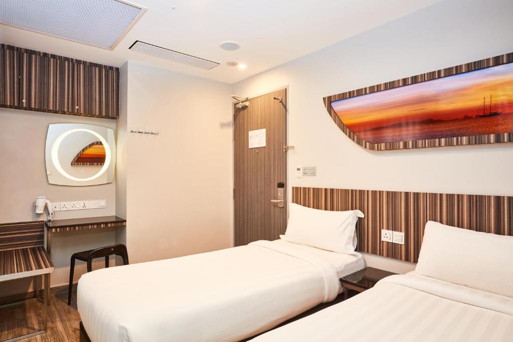 Двухместный (Двухместный номер в коттедже с 2 отдельными кроватями) отеля Fragrance Hotel - Selegie, Сингапур (город)