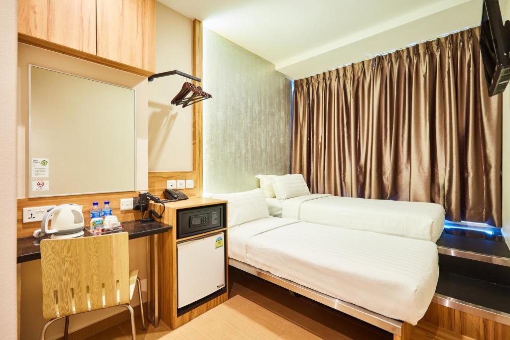 Двухместный (Двухместный номер Делюкс с 2 отдельными кроватями) отеля Fragrance Hotel - Waterfront, Сингапур (город)