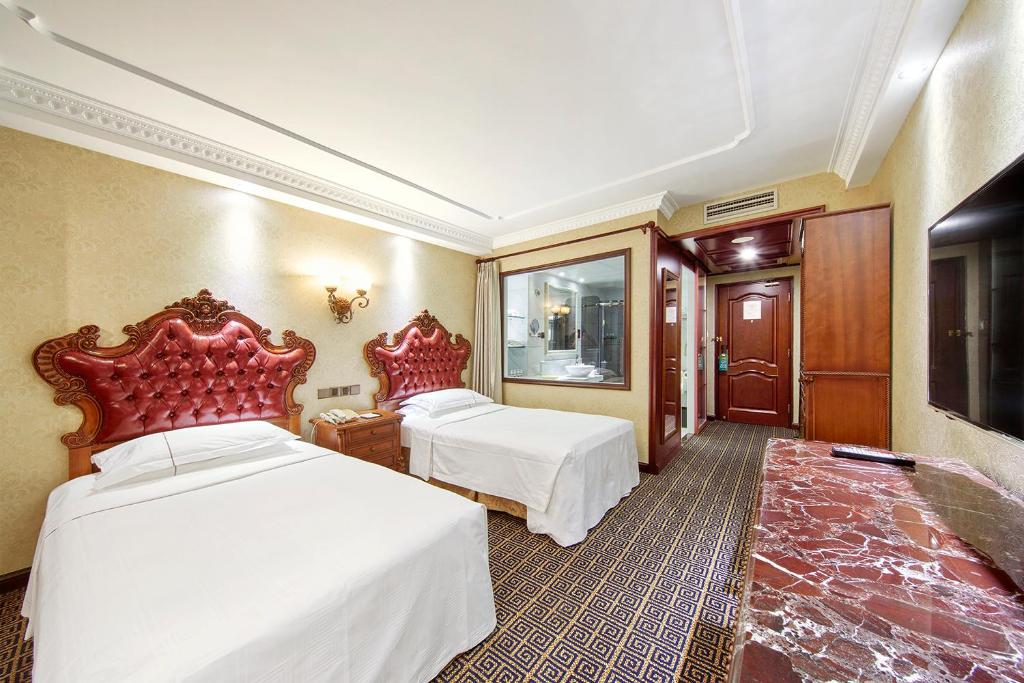 Двухместный (Двухместный номер бизнес-класса с 2 отдельными кроватями) отеля Grand Regency Hotel, Циндао