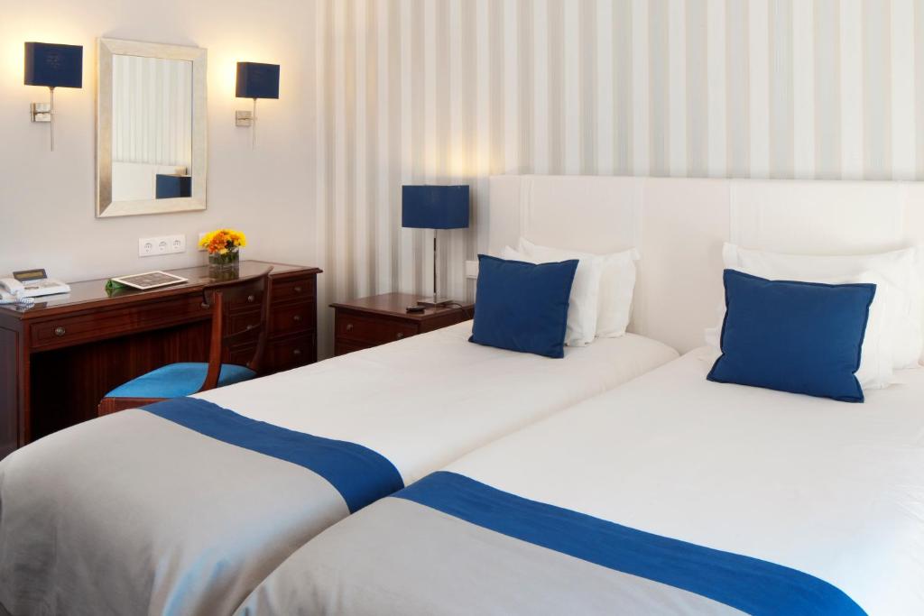 Двухместный (Двухместный номер с 1 кроватью и дополнительной кроватью (для 2 взрослых и 1 ребенка)) отеля Senhora da Guia Cascais Boutique Hotel, Кашкайш