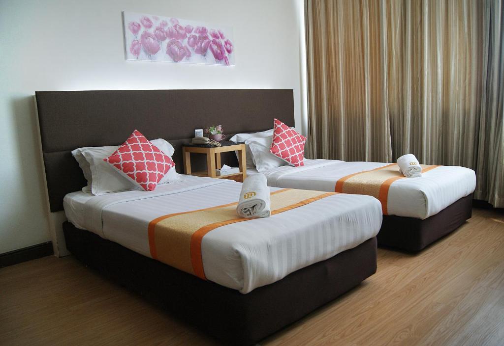 Двухместный (Улучшенный двухместный номер с 2 отдельными кроватями) отеля Tang Dynasty Hotel, Кота-Кинабалу