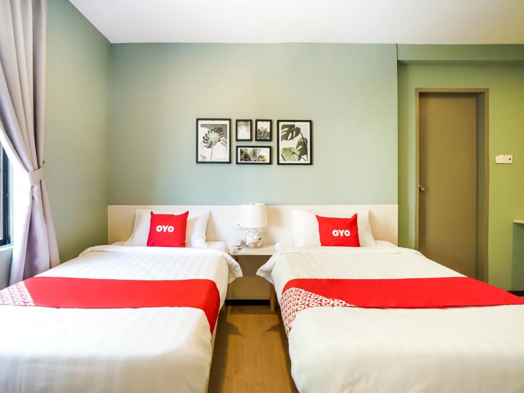 Двухместный (Стандартный двухместный номер с 2 отдельными кроватями) отеля OYO 89603 Treeline Urban Inn, Кота-Кинабалу