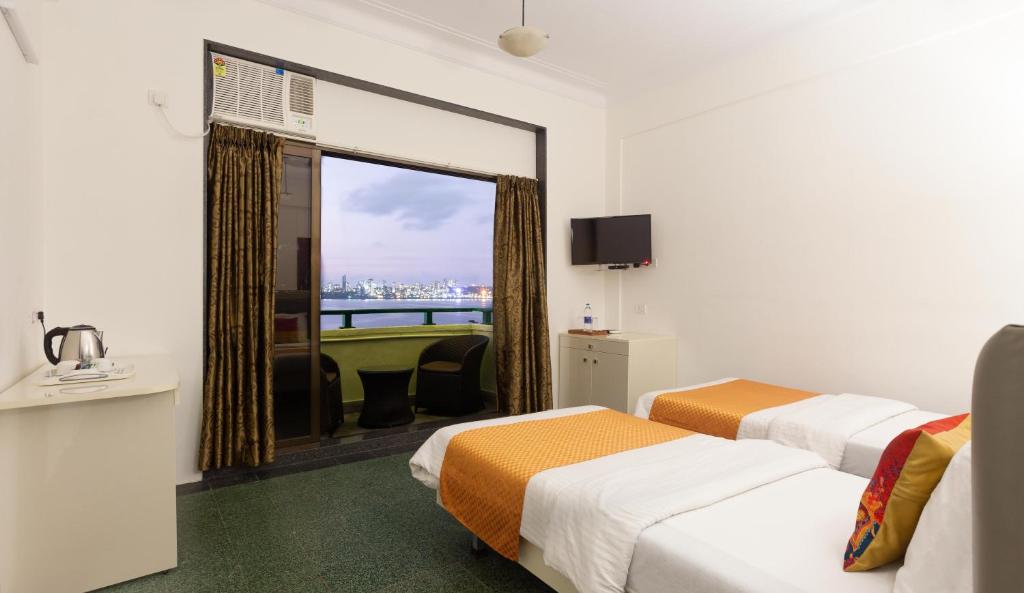 Двухместный (Улучшенный двухместный номер с 1 кроватью или 2 отдельными кроватями и видом на море) отеля Sea Green South Hotel, Мумбай