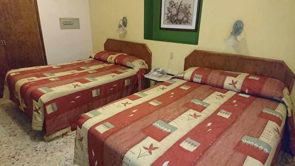 Двухместный (Двухместный номер с 2 двуспальными кроватями) отеля Hotel Suites Kino, Эрмосильо