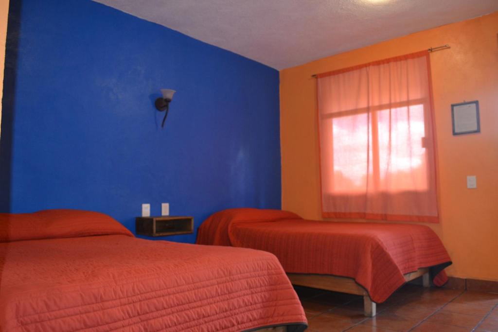 Двухместный (Двухместный номер с 2 двуспальными кроватями) отеля Hotel Quetzalcalli, Сан-Хуан-Теотиуакан
