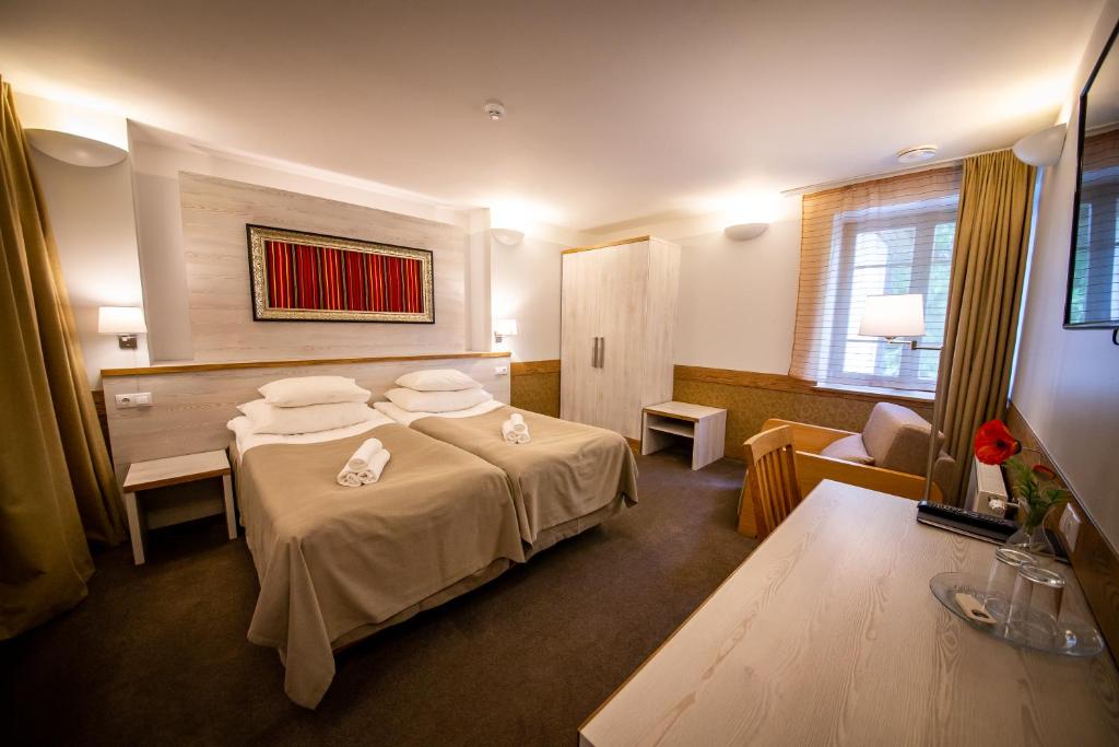 Двухместный (Улучшенный двухместный номер с 1 кроватью или 2 отдельными кроватями) отеля Hotel Liilia, Кайна
