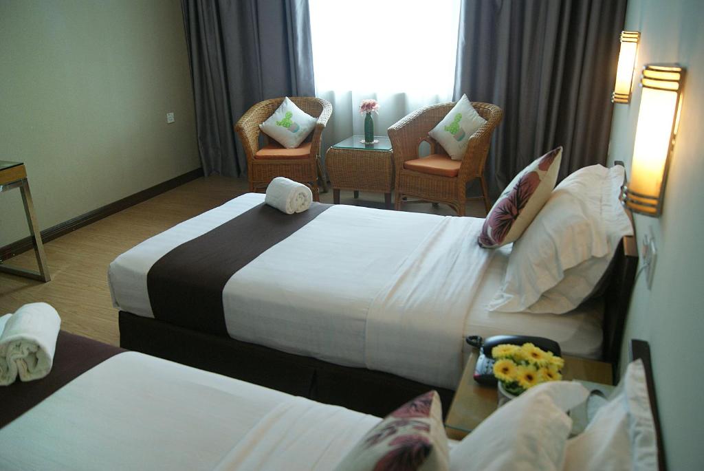 Двухместный (Двухместный номер Делюкс с 2 отдельными кроватями) отеля Tang Dynasty Park Hotel, Кота-Кинабалу