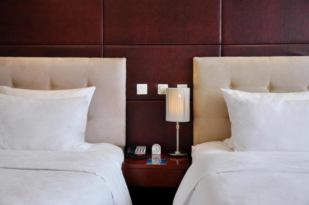 Двухместный (Представительский двухместный номер с 2 отдельными кроватями и правом посещения лаунджа) отеля Pullman Beijing South, Дасин
