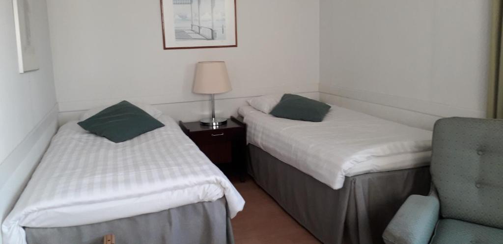 Двухместный (Двухместный номер с 2 отдельными кроватями) отеля Kauppahotelli Grand, Лахти
