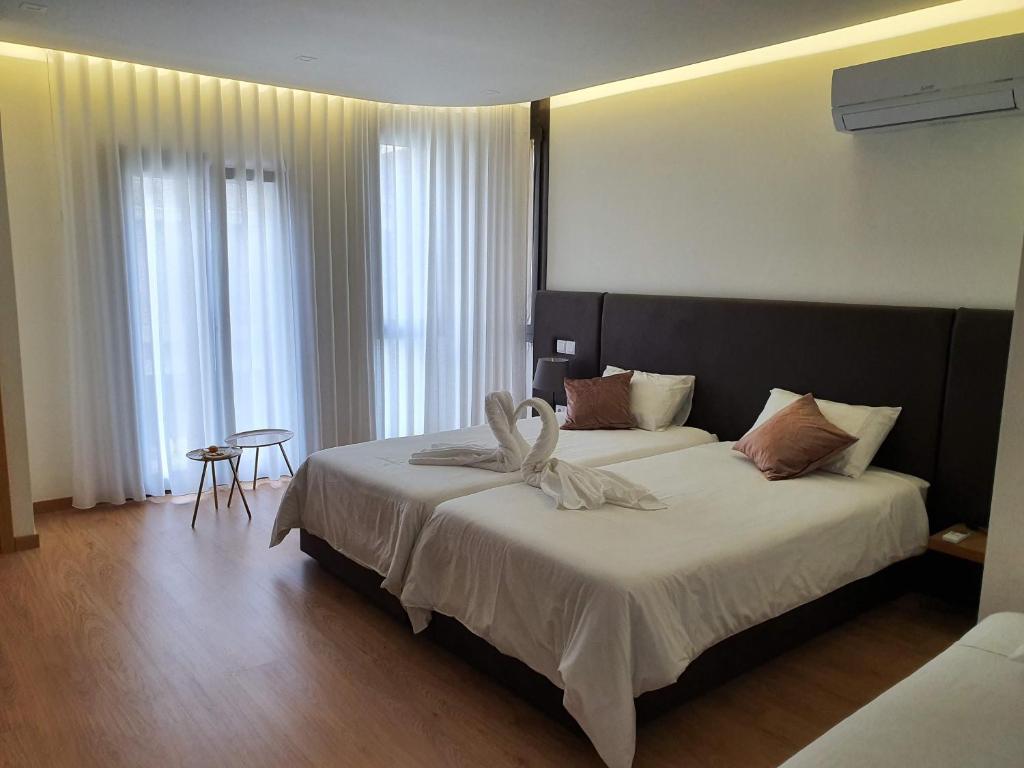 Двухместный (Двухместный номер с 1 кроватью или 2 отдельными кроватями и романтическим пакетом услуг) гостевого дома Residencial Dom Manuel, Фафи