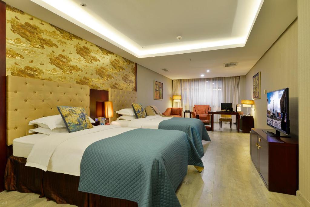 Двухместный (Двухместный номер Делюкс с 2 отдельными кроватями) отеля Merlinhod Hotel Xi'an (Formerly Meihua-Goldentang , Сиань
