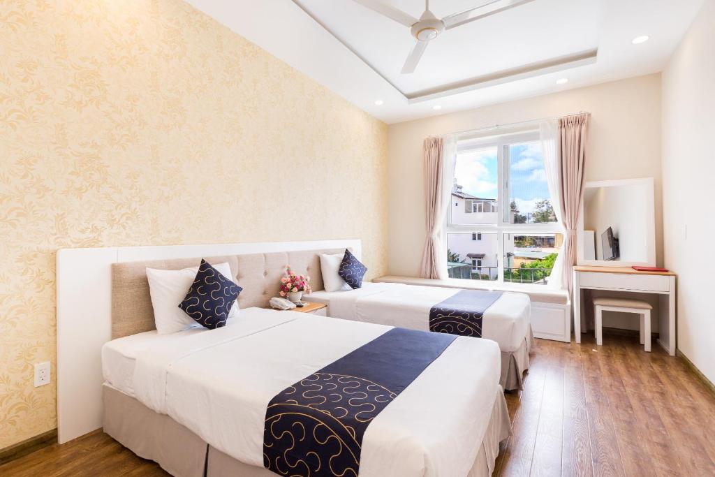 Двухместный (Улучшенный двухместный номер с 2 отдельными кроватями) отеля Capital O 585 Saigon Book Da Lat Hotel, Далат