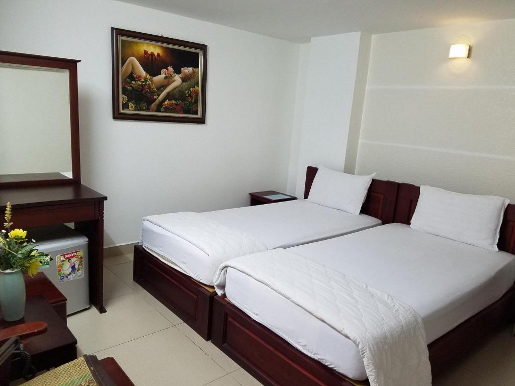 Двухместный (Двухместный номер Делюкс с 2 отдельными кроватями) отеля Dinh Dinh 2 Hotel, Хошимин